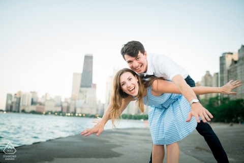 Chicago couple portrait being playful with the city as their backdrop