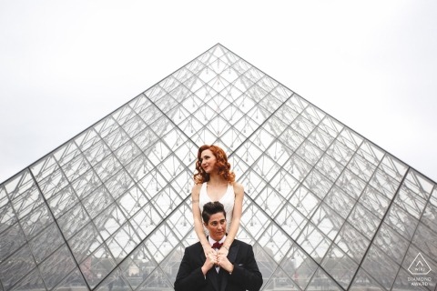 wedding engagement shoot with a couple and a glass structure | Paris pre-wedding photographer session