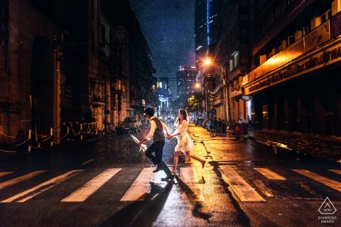 Rain engagement photograph in the streets of Ho Chi Minh city Vietnam 