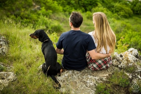 Stránská Skála couple enjoying the view with their dog during portrait shoot