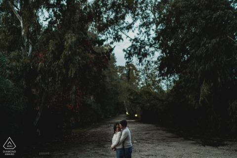 Engagement Photography in Naples standing on a path surrounded by trees
