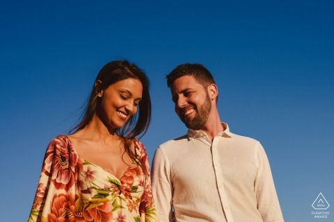 Ouro Preto, Brazil engagement photos of a couple in the afternoon sun with a blue sky.