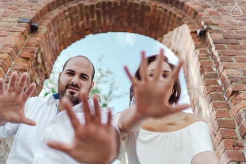 London, England engagement photo with hands under a brick arch London, England engagement photographer: They were a blast to photograph!