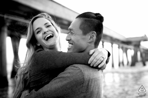 Engagement Photography Session from Marina Del Ray - couple laughing on the beach in black and white 