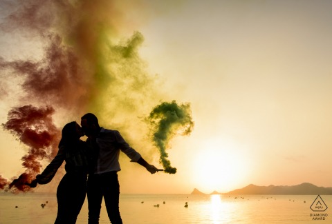Aguilas - Spain engagement photographer - Beautiful sunset between smoke from flares and an unforgettable kiss