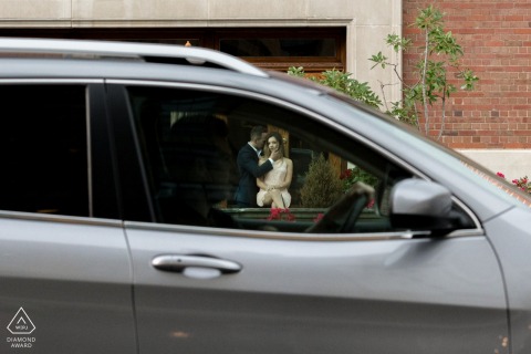 the couple was posing for the photo, and the car stopped just at the traffic lights in Detroit