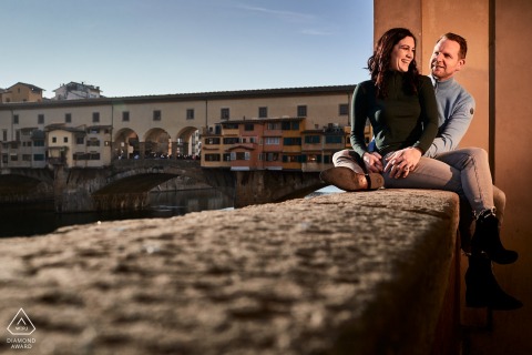 Seated and lit couple engagement image from Florence