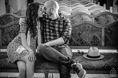 Jaen Andalusia prewedding photos of a couple seated indoors in black and white