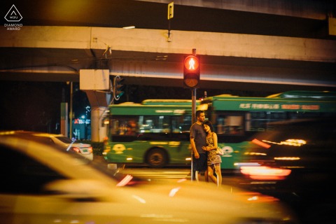 Guangzhou pre - wed image with some night life Embracing in the traffic under the lights