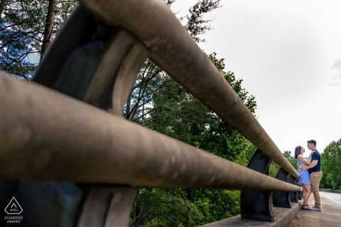 True Love Engagement Portrait Session at the Foothills Parkway in TN showing a couple standing next to one of the parkways bridges