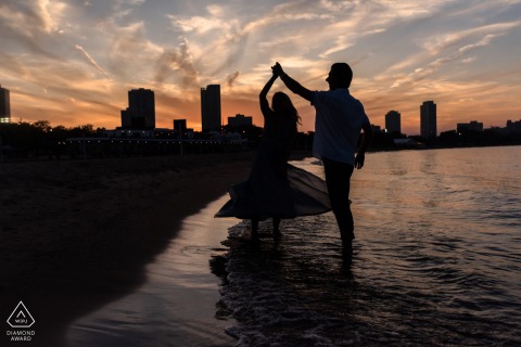 Chicago bride and groom to be, posing for a pre-wedding engagement photo shoot at the North Avenue Beach Chicago bride and groom to be, posing for a pre-wedding engagement photo shoot at the North Avenue Beach