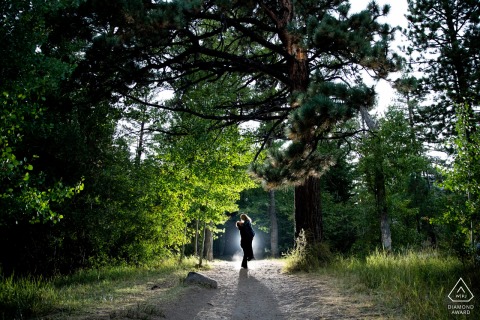 Nevada bride and groom to be, modeling for a Galena Forest pre-wedding picture that is back lit with a beautiful lift