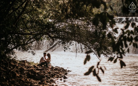 Amambai bride and groom to be, modeling for a pre-wedding picture while connected in the middle of nature by the lake