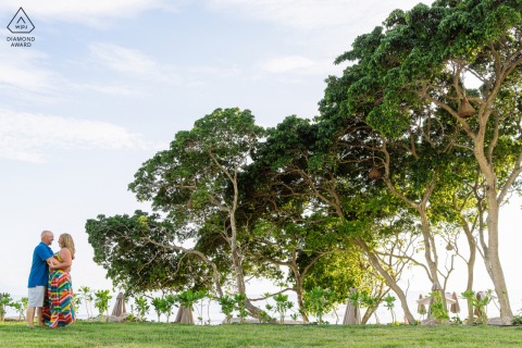 Pre-wedding Mexico couple portrait-session at Secrets Punta Mita on the grass lawn below the big trees