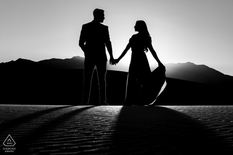 A Texas Wedding, Elopement, and Engagement Photographer created this silhouette, black and white portrait of this TX couple posing at sunset at The White Sands National Monument