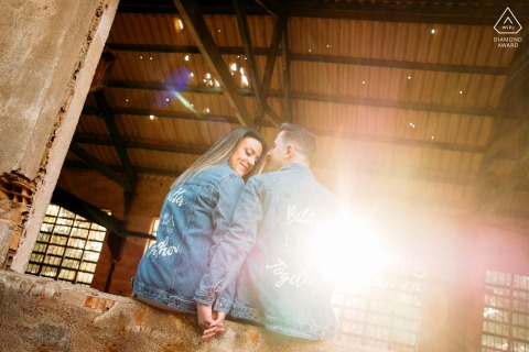 A Murcia couple poses during a Portmán lifestyle portrait photography session in an old building with sunlight