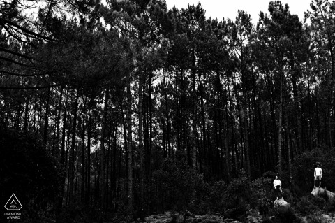 Sintra post proposal portrait session with a Lisbon engagement photographer of a Portugal couple standing in rocks with big trees in the background Sintra post proposal portrait session with a Lisbon engagement photographer of a Portugal couple standing in rocks with big trees in the background