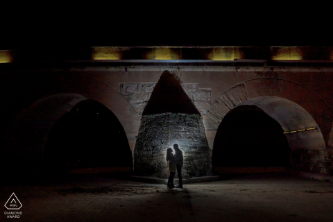 Granada, Spain engagement photo session at night near the arched bridge