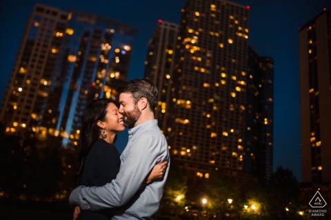 She said yes, post marriage proposal picture session in Chicago for an Engaged couple who snuggles amid the Chicago city lights