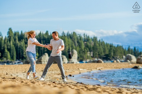 After the wedding proposal engagement picture session in Zephyr Cove, Lake Tahoe for a Couple having fun near the water