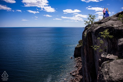 A Minnesota, on location couple lifestyle portrait at Palisaide Head created while they are standing near a cliff A Minnesota, on location couple lifestyle portrait at Palisaide Head created while they are standing near a cliff