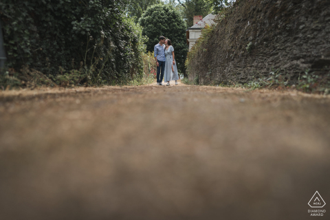 Bouchemaine lifestyle couples photography session in France showing a low angle look of the lovers in a narrow roadway