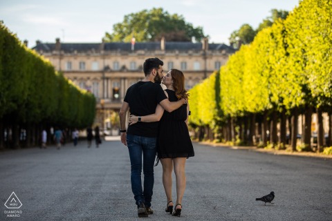 Nancy nontraditional lifestyle engagement portrait of a walking and kissing couple in a symmetrical scene
