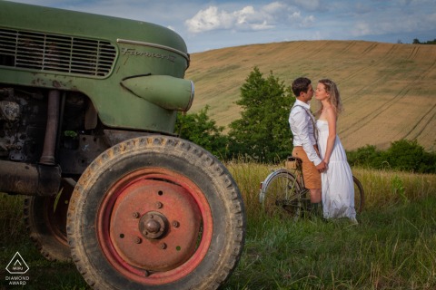 Marciac, Gers couple portrait in the farmers field with a vintage tractor 