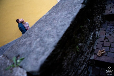 Iseo Lake Italia couple are posing for a high angle portrait following a walk in the city