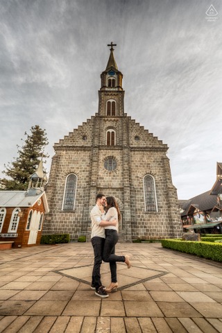 The picturesque city of Gramado in Rio Grande do Sul is the perfect backdrop for an engagement portrait session, with its iconic Cathedral of Pedra being a popular destination for couples to celebrate their love