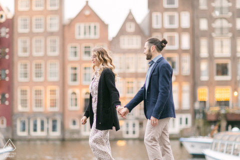 The couple celebrated their engagement with a romantic walk in Amsterdam, Netherlands at sunset