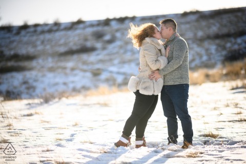  The couple braved the windy weather to have their romantic engagement portrait taken against the gorgeous backdrop of Horsetooth Reservoir in Fort Collins, Colorado