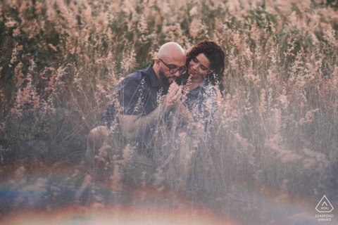 Couple embracing and looking lovingly at each other in Atalaia, AL - captured by a skilled wedding photographer.