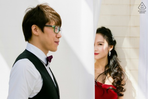 A pre-wedding portrait at Diaoyutai State Guesthouse in Beijing featuring a woman facing the camera and a man in profile facing to the right.