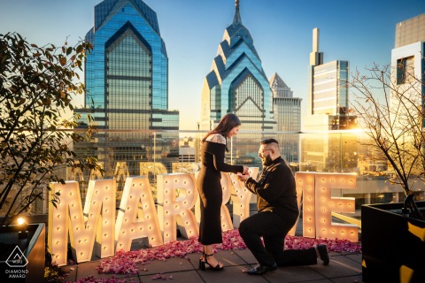 A couple celebrating an extravagant proposal at the W Hotel in Philadelphia, surrounded by elegance and luxury.