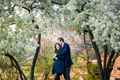 Love Blossoms Under New Blooms at Cafe Brauer, Lincoln Park Outside Cafe Brauer in Lincoln Park, Chicago, IL, a couple embraces under newly blooming trees, surrounded by the fresh vibrancy of spring, highlighting their affection and renewal.
