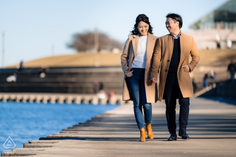 Chicago winter engagement: couple strolls Lake Michigan near Adler Planetarium.