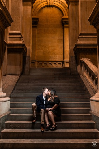 The couple kiss and sit on the iconic stairs of the Philadelphia Museum of Art during their engagement.