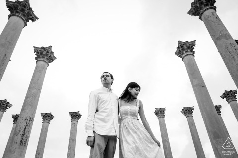 A couple at the National Arboretum, Washington DC, smiles lovingly, revisiting the special location of their first date.