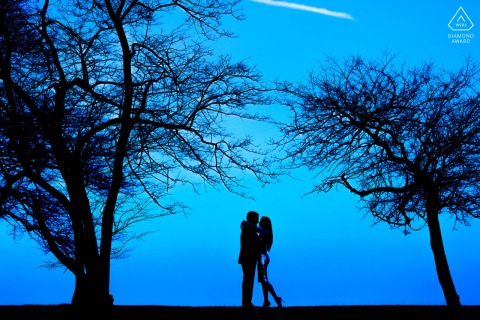 Silhouetted couple stands together at Fullerton Beach, Chicago.
