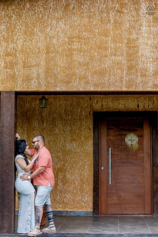 Joyful Engaged Couple Celebrate Love at Home Entrance in Beautiful Viamão, Brazil Engaged couple posing at their Viamão home entrance, joyfully celebrating engagement.