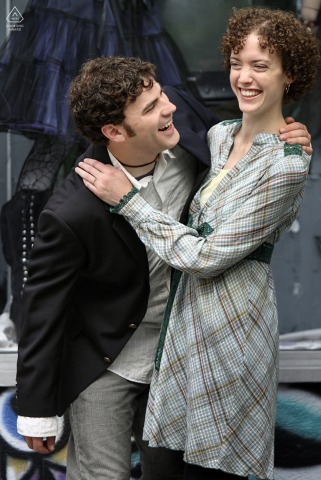 Couple laughing joyfully while posing together in Little Five Points, Atlanta.