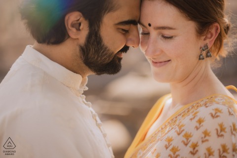 Engaged couple, Indian boy and Australian girl, embracing in Maharashtra, celebrating love and cultural roots.