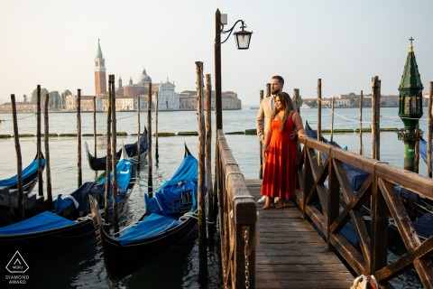 Engaged couple poses in St. Mark's Square, Venice, during a serene early morning photoshoot.
