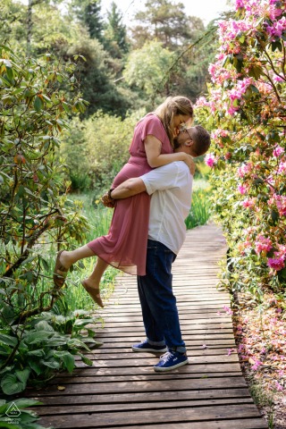 SEELEGER MOOR PARK, Zurich — On a walking trail, a groom-to-be lifts his partner high. This portrait beautifully captures their love, surrounded by the scenic park.