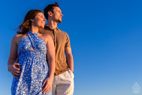 DENNIS, Mass. — Standing in profile, a couple looks toward the future on Mayflower Beach. Their portrait, framed by endless blue, captures a peaceful and hopeful confidence.