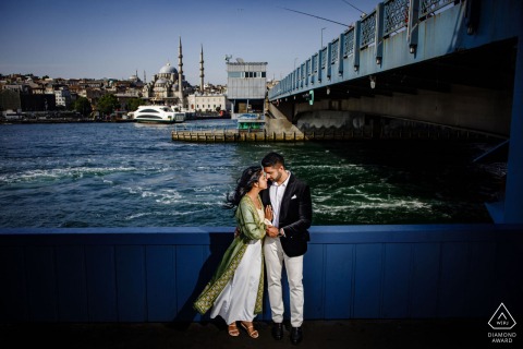 A couple poses by the busy Eminönü ferry launch in Istanbul during their pre-wedding photo session.