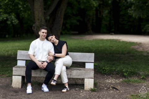 Hármashatárhegy, Hungary — A couple leans in close on a park bench, capturing calm connection and pure comfort in this serene and intimate portrait.
