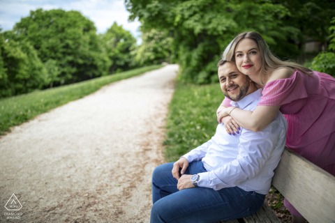 Hármashatárhegy, Hungary — A couple embraces joyfully, framed by tranquil nature, capturing the warmth of love and the promise of the journey ahead in this vibrant portrait.