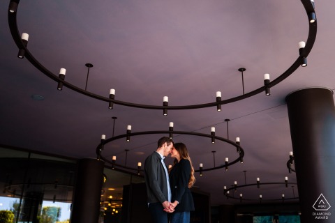 Portopiccolo, Sistiana, Trieste, Italy — A couple poses amid striking geometric shapes, blending modern architectural elements with romance in this contemporary portrait.